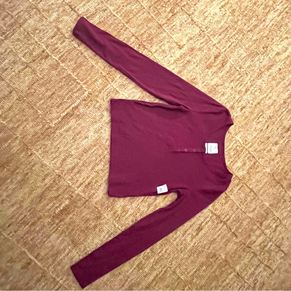 Long sleeved thermal Henley crop top. Mulberry color